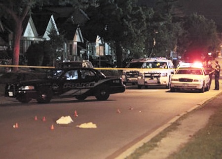 Police investigate the scene of a serious hit-and-run accident on Fallingbrook Road north of Kingston Road on the night of Thursday, July 18. According to witnesses, a vehicle sped up to strike a man who was on the road, and then took off. The victim died as a result of his injuries in hospital on Saturday, July 20. PHOTO: John Hanley