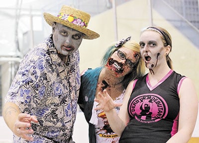 From left to right, Shannon Stafford and Tiffany Mark of the Toronto Zombie Walk join the GTA Rollergirl`s `Lyoness`by the track at the Ted Reeve Bubble during the GTARs season closer on September 7. Organized by Stafford, Mark and the other undead members of the Committee of 13, the annual Zombie Walk and Halloween Parade will leave Nathan Philips Square at 3 p.m. on October 26. PHOTO: Andrew Hudson
