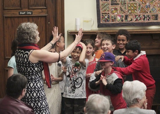 A choir from Roden Public School shares a laugh with librarian Gail Ferguson after singing Pennies from Heaven for a 90th anniversary celebration at the Gerrard Ashdale Library on May 15. PHOTO: Andrew Hudson