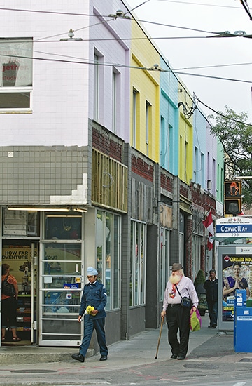 Early morning shoppers walk by nine Gerrard Street shops getting a colourful new look on Saturday, Sept. 20. PHOTO: Andrew Hudson