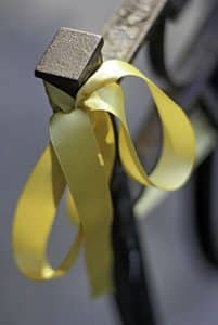 A yellow ribbon is tied around a railing on the front porch of Mega and Ghassemi-Shall's house. PHOTO: Andrew Hudson