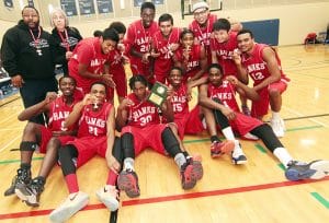 Danforth Collegiate’s senior boys basketball team celebrate the nail-biting, overtime win over Forest Hill that made them city champions on Feb. 17 at George Brown College. PHOTO: Andrew Hudson