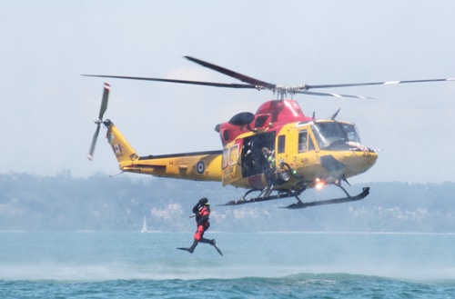 Master Corporal Jonathan Pothier leaps out of the 424 Transport and Rescue squadron helicopter during a joint training excercise between the 424 and the Pickering Auxiliary Rescue Association. PHOTO: Andrew Hudson