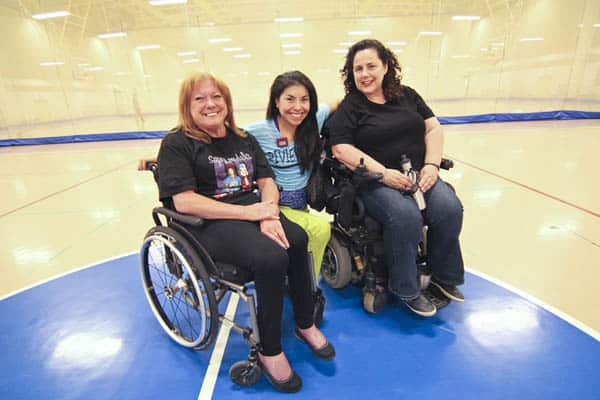 From left, Jay Allison, fitness instructor Valeria Alvia and Mary Caruso are all smiles after an hour of intense Zumba exercises at Variety Village on May 15. Twice a year Variety Village hosts some 200 people, seated and standing, in a giant ‘Zumba-thon’ that raises funds for the community centre. PHOTO: Andrew Hudson