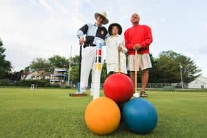 From left, Don Short, Nikki Holwell, and Jim Chorney break from a round of croquet at the Kew Gardens Lawn Bowling Club. Short, who got croquet started at Kew, discovered the sport after jumping an unusual hoop – by winning a prize on the TV game show Bumper Stumpers, which landed him at a Disney World hotel with a real croquet green. The winning puzzle? The licence plate of a deposit-bottle collector: HRS YRQB. Short remembers the answer well: “Here’s your quarter back!” PHOTO: Andrew Hudson