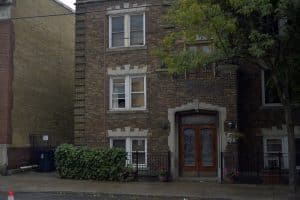 Kew Park Mansions, pictured here October 17, 2016, has added some shrubbery and floral arrangements since the photograph at the top of the story was taken in 1995. 