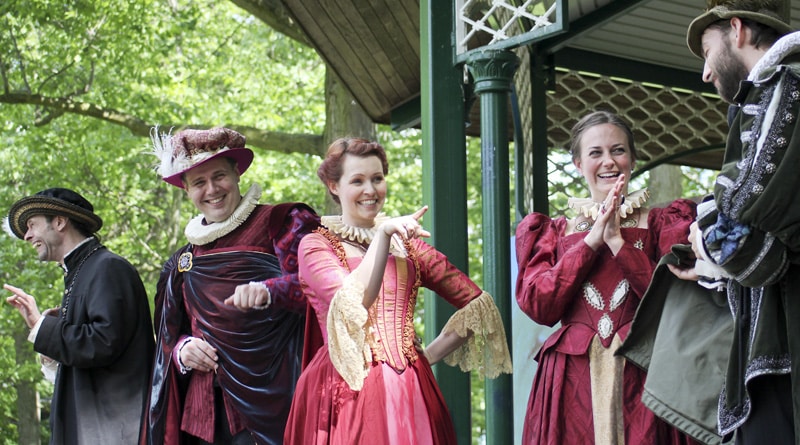 Actors Ashley Gibson, centre, and Melissa Beveridge, at right, share a laugh at jealous husbands while playing Mistress Page and Mistress Ford, the wives in Shakespeare's The Merry Wives of Windsor. PHOTO: Andrew Hudson