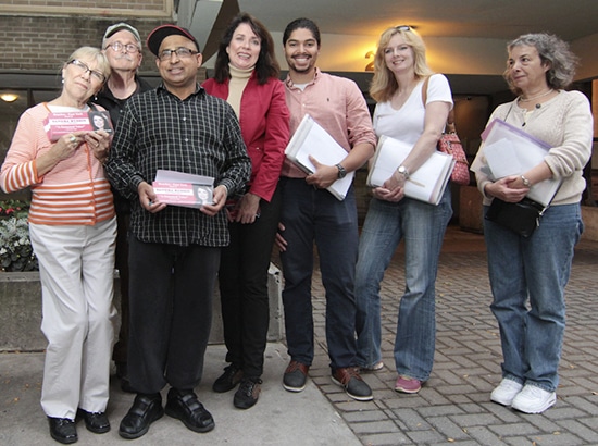 Sandra Bussin, centre, pauses for a photo with campaign volunteers outside Main Square on Oct. 14. PHOTO: Andrew Hudson