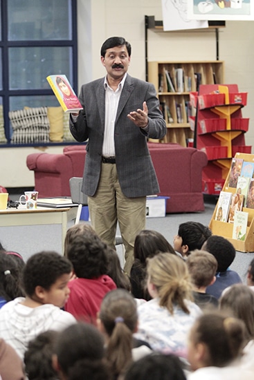 Ziauddin Yousafzai, father of Pakistani blogger and girls’ rights activist Malala Yousafzai, speaks to Grade 4 and 5 students at Secord Elementary School on March 29. Along with Plan Canada president Rosemary McCarney, a Beacher who wrote a recently published picture book called Every Day is Malala Day, Ziauddin spoke about the rights of all girls and boys to go to school, free from forced labour and the kind of misogynist violence his daughter survived. Before he let the students get back to class, Ziauddin, a long-time teacher, asked them to recite a line by the poet Khalil Gibran: “Keep me away from the greatness that does not bow to children.” PHOTO: Andrew Hudson