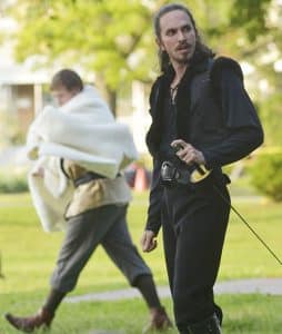 Hamlet, played by James Soares-Correia, speaks with a sword at his side during a performance at Norwood Park. PHOTO: Jon Muldoon