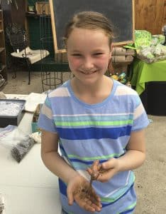 Emma Biggs, co-author of a new gardening book with her dad, shows what her earthworms can do. PHOTO: Mary Fran McQuade