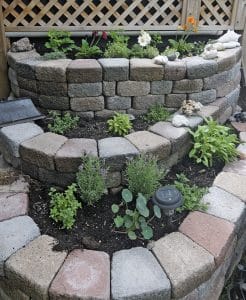 The garden owner built raised beds that do double-duty as insulation for a workshop. PHOTO: Jon Muldoon