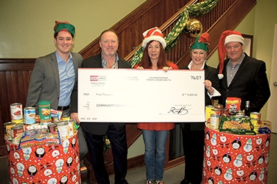 Royal LePage Estate Realty presented Community Centre 55 with a cheque for $5,000 on Dec. 17 for the Centre’s annual Share A Christmas program. The money helped to provide food and toys to almost 800 families during the holiday season. Pictured from left are Royal LePage’s Andrew Schultz and Keith Burton, Debbie Visconti, executive director of Centre 55, and Jennifer Burton and Chris Dunlop of Royal LePage.