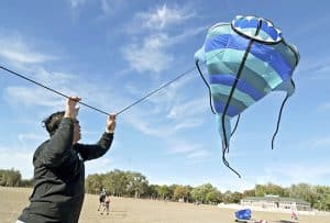 Gary Mark from the Toronto Kite Fliers raises his New Zealand-made pirahna kite over Woodbine Beach on Sept. 20.  Mark and other club members got together for an informal flying session under sunny skies – a boon for Mark, who was doing double duty by drying out his kites after the previous afternoon’s downpour.  Flying kites is a passion for Mark, who left the following day for a kite festival in Borneo. PHOTO: Jon Muldoon